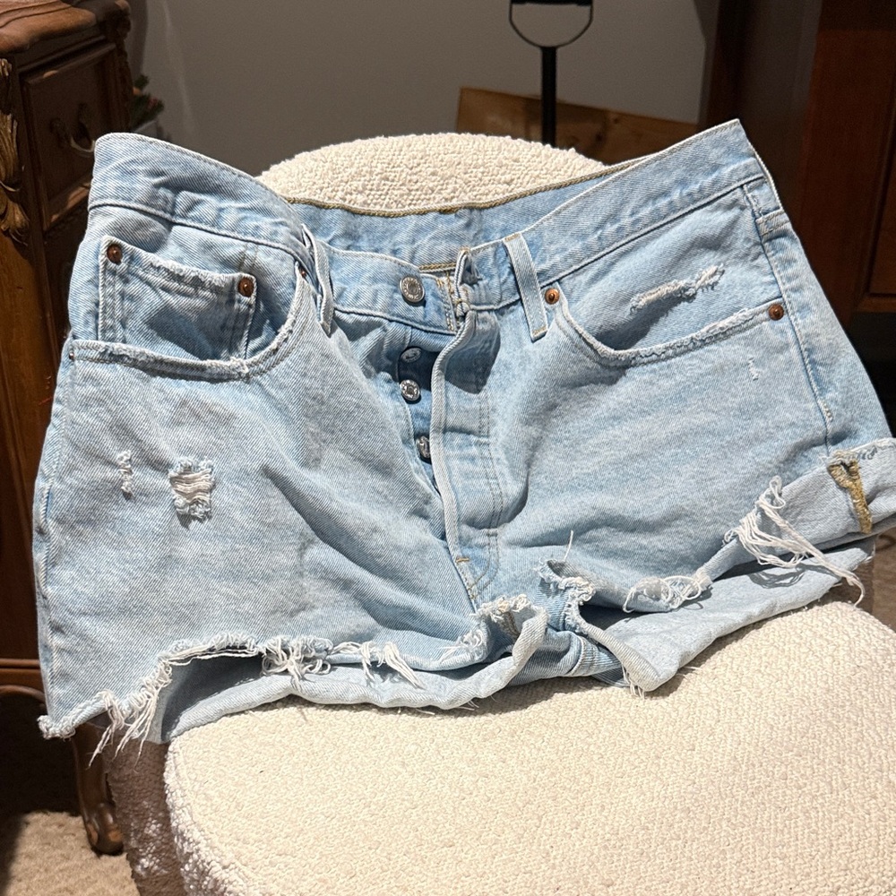 Levi’s 501 Light Blue Distressed Denim Shorts